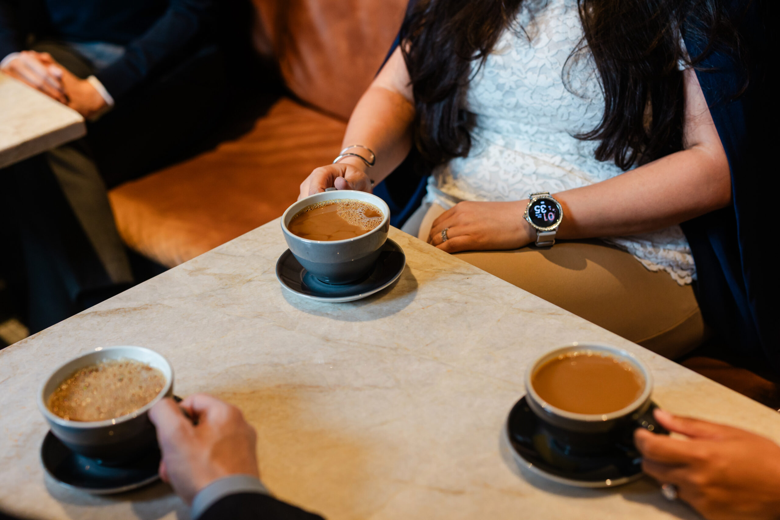 a group of co workers enjoying coffee together 