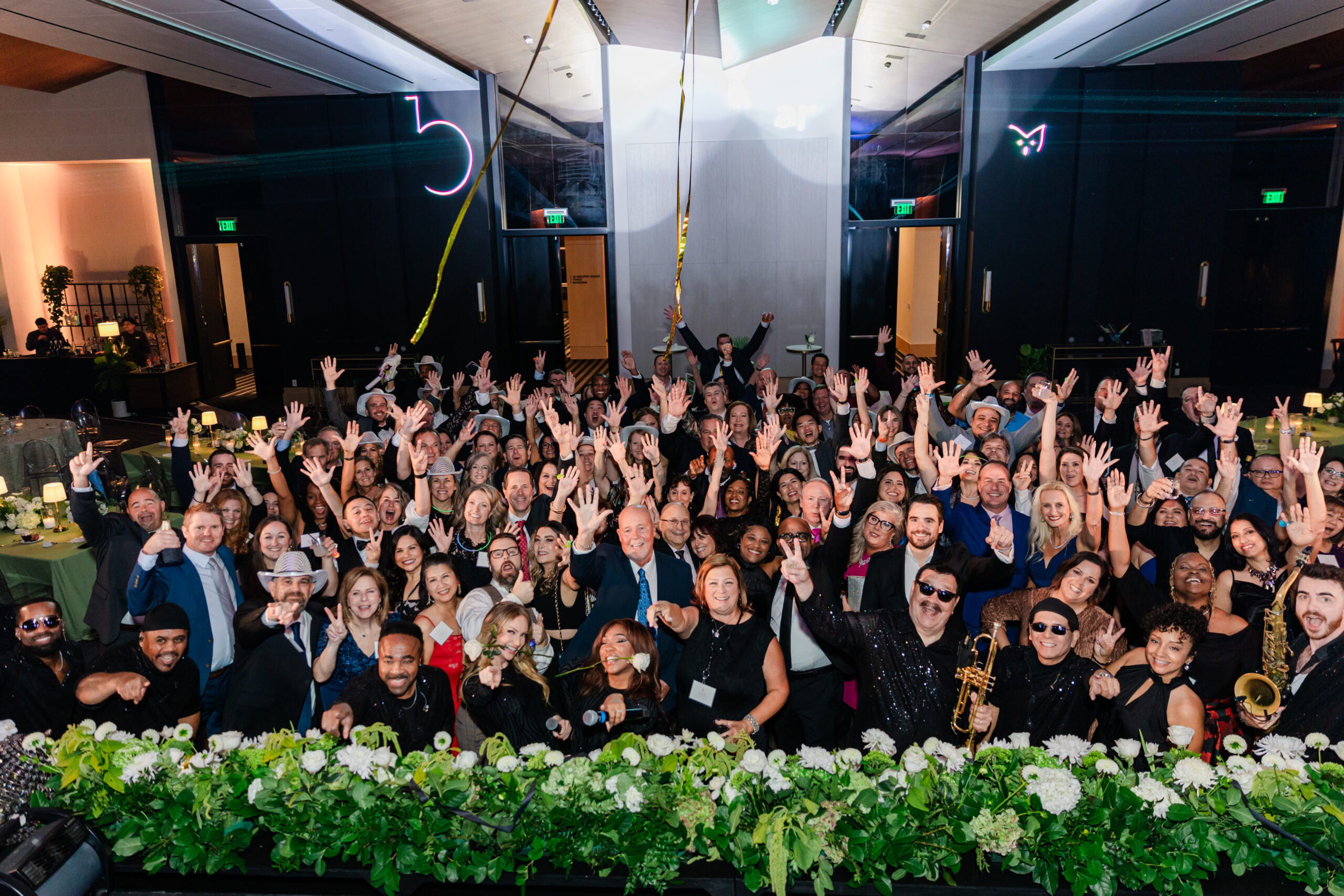 the team of berkley entertainment taking a photo at their corporate celebration at the jw marriott dallas