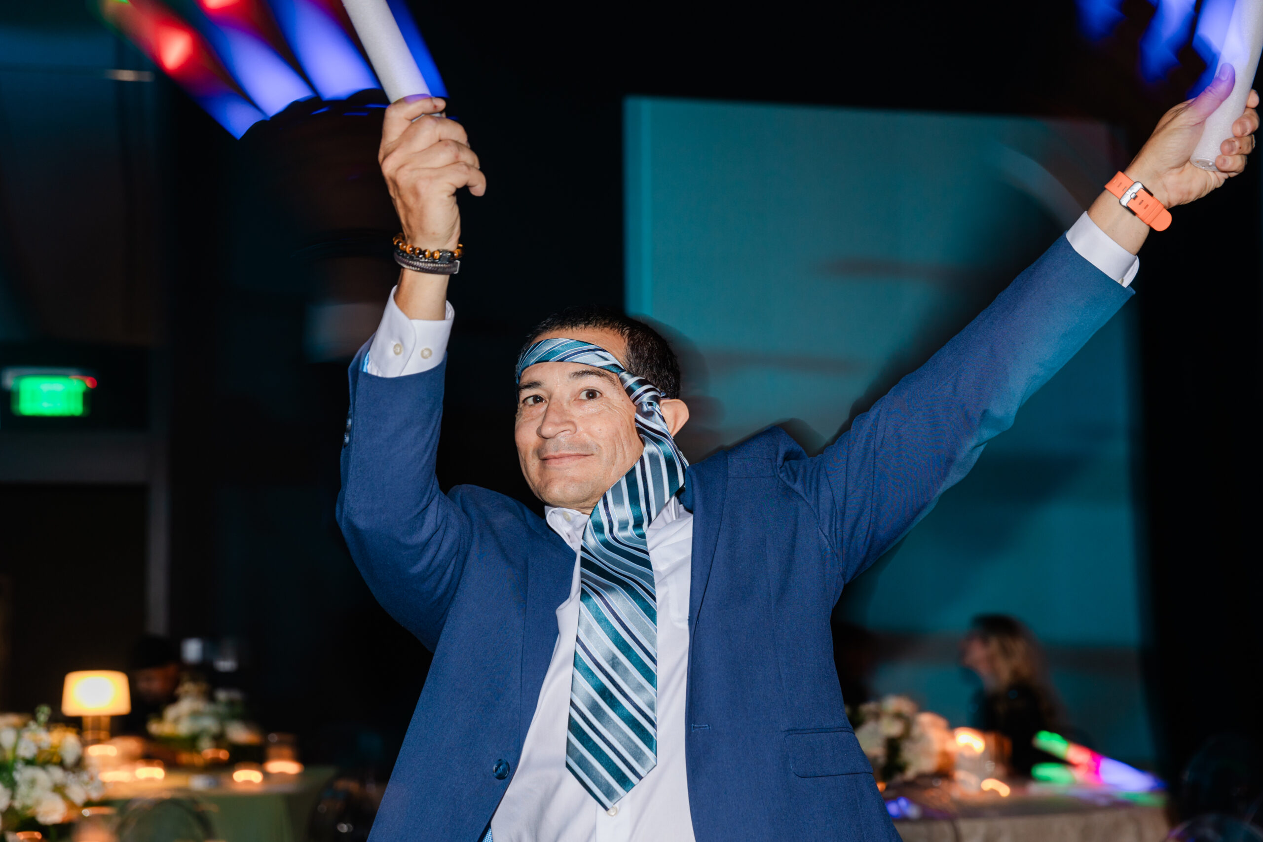 a man dancing on the dance floor at the jw marriott dallas for a corporate celebration