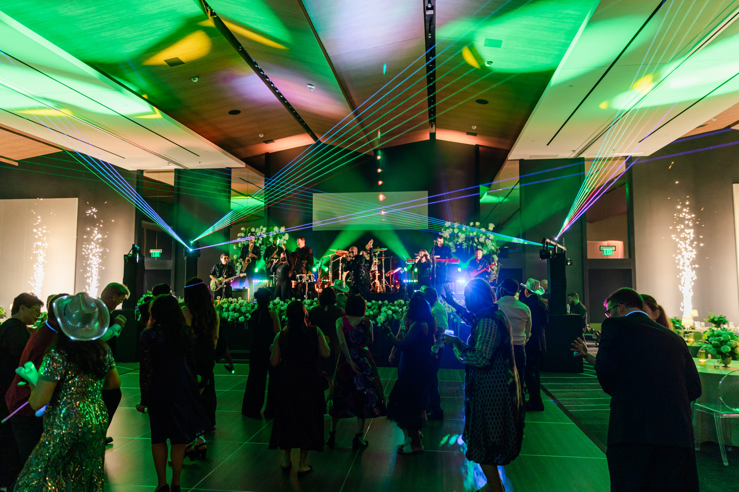 a group of people onthe dance floor at the jw marriott dallas for a corporate event