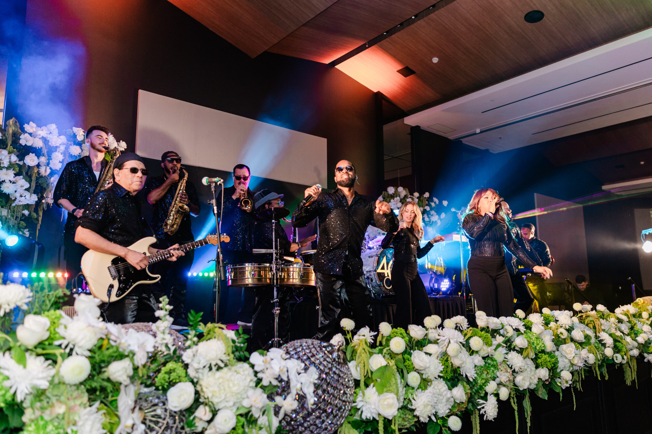 a band playing at a corporate event at the jw marriott dallas on a stage