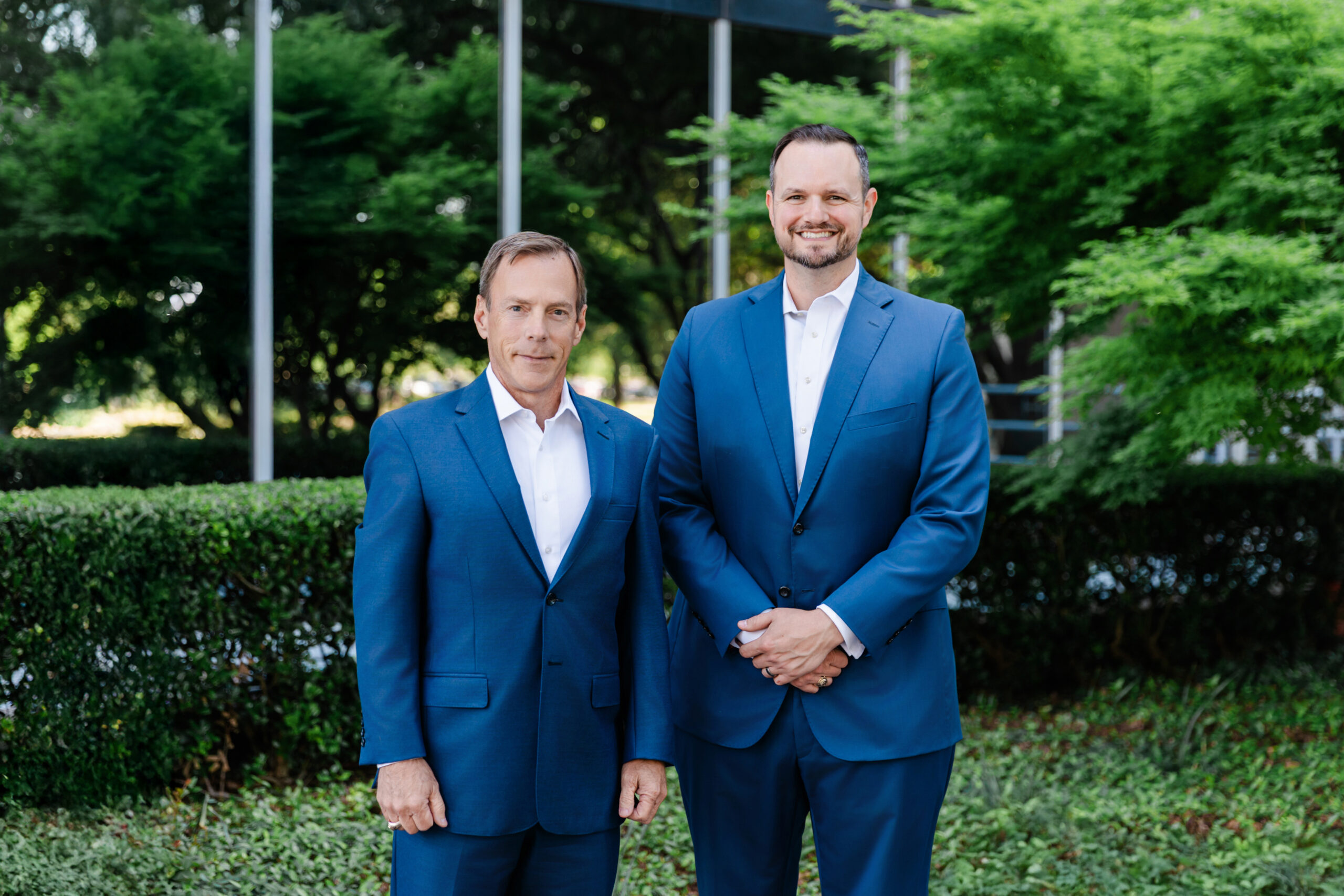two men taking formal, corporate headshots in dallas outside 