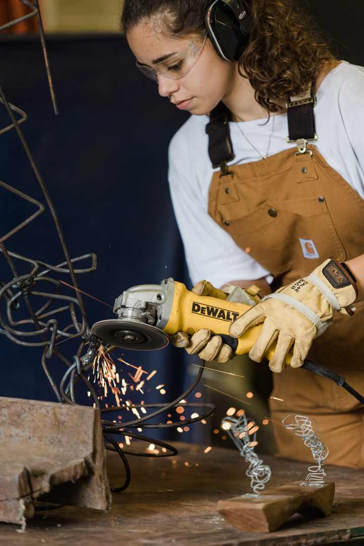 Photo of a welder working in her studio.