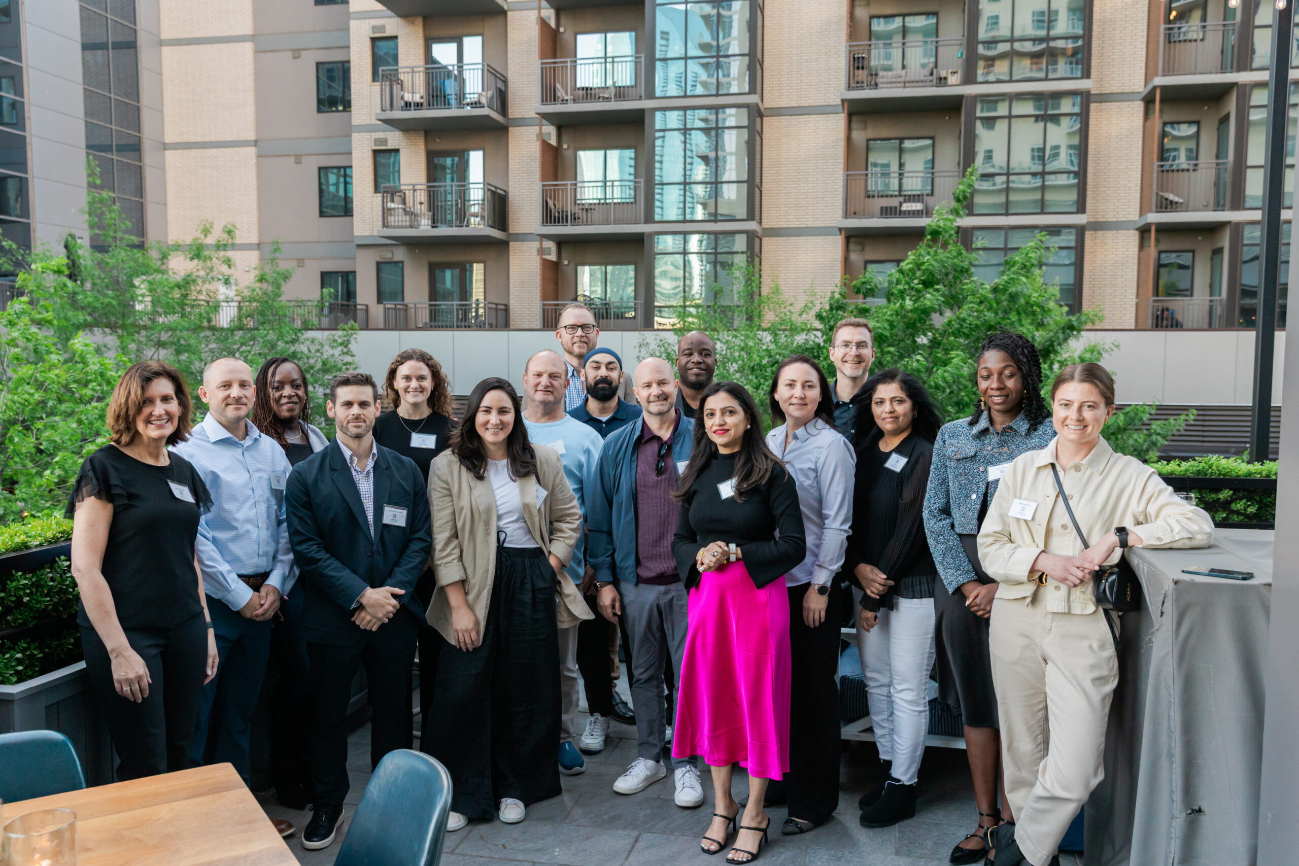 networking guests taking a photo on the patio of the henry