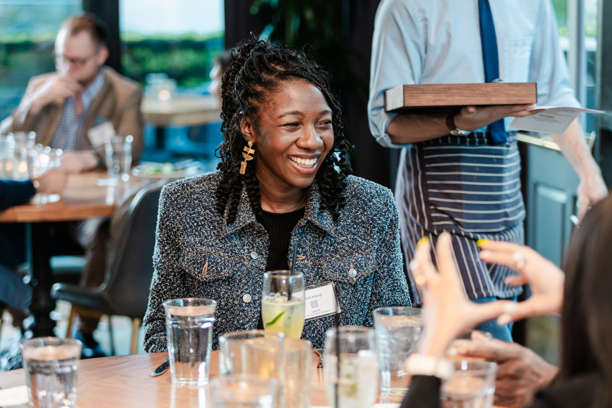 a woman laughing at a corporate event hosted in dallas