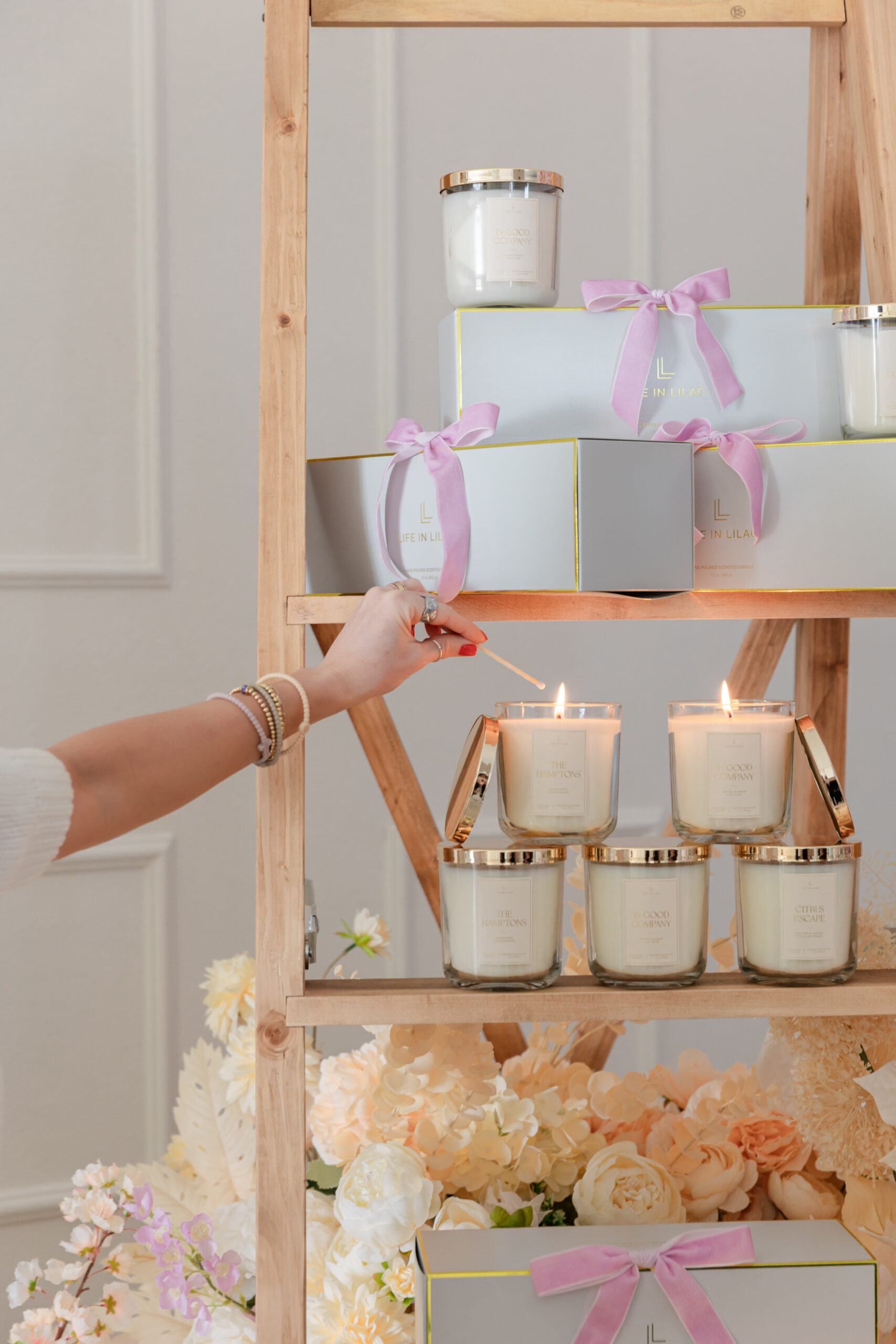 Life In Lilac candle products on a ladder display