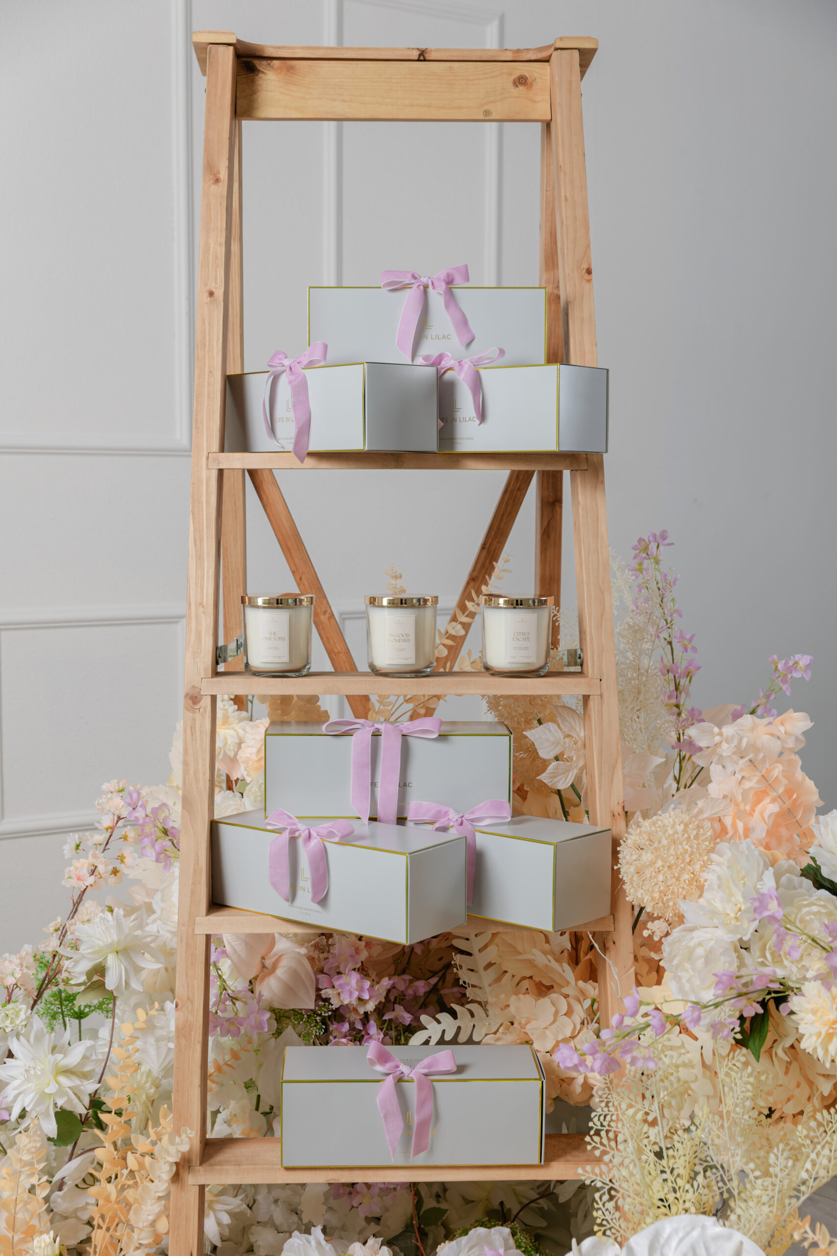 Life In Lilac candle products on a ladder display