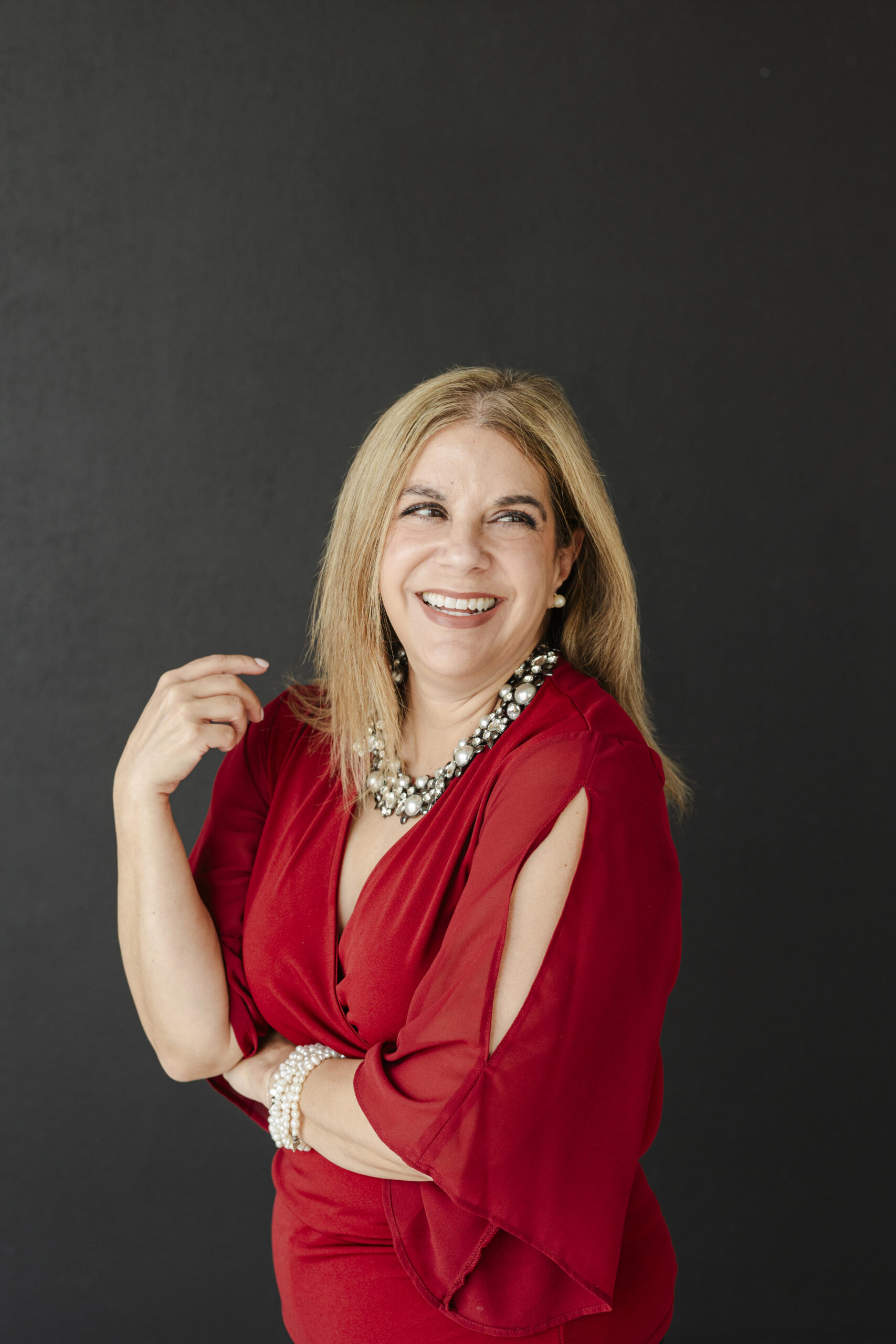 a woman taking personal branding photos at the lumen room in texas 